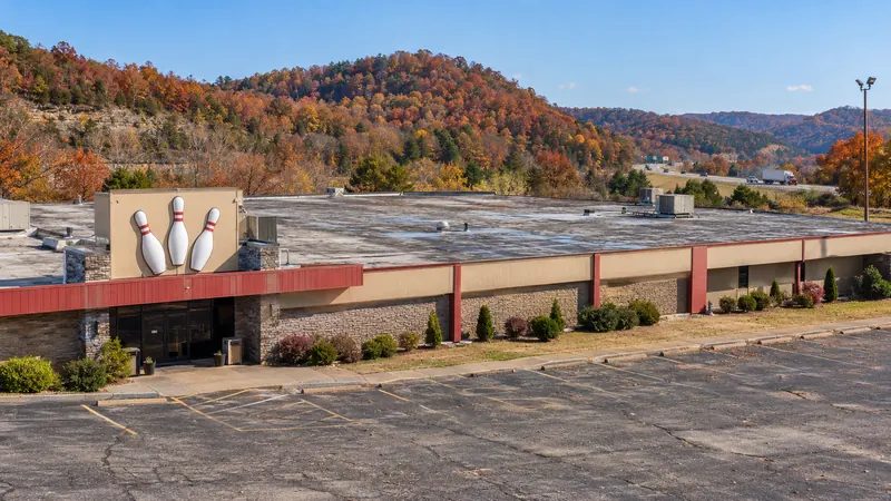 Brick commercial building with a low-slope roof behind a parapet